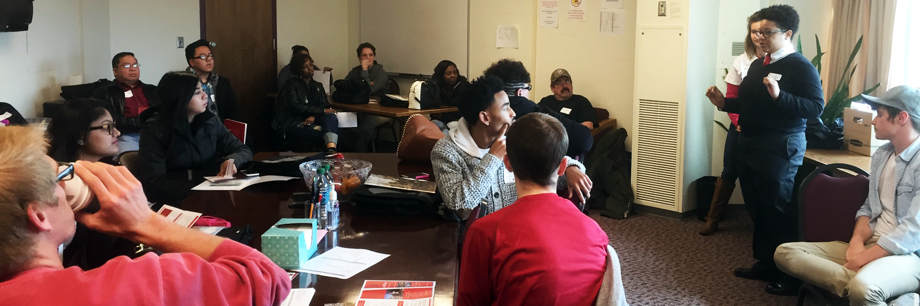 Students listen attentively to a presenter. 